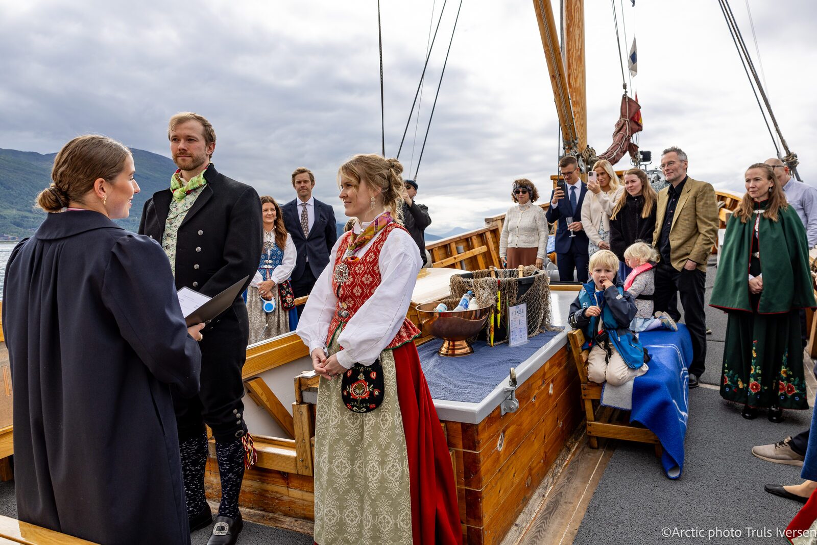 A wedding ceremony on the deck of the historic wooden vessel Hermes II in Tromsø
